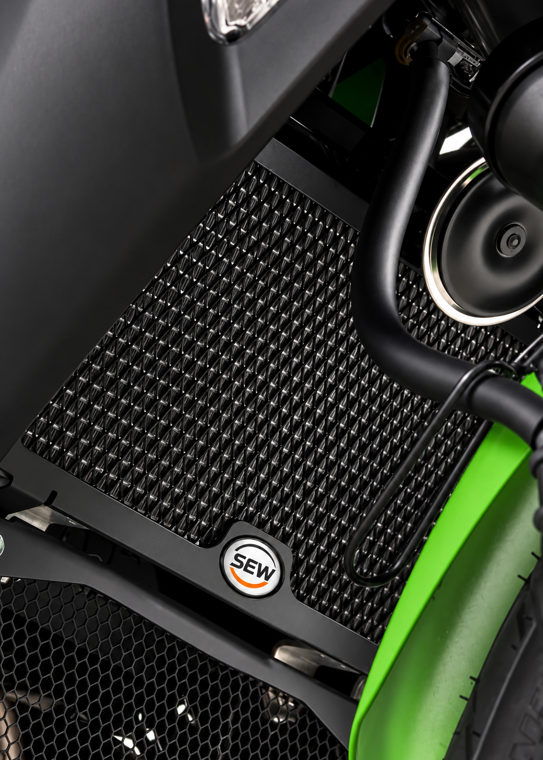 Heavy-duty black metal radiator guard for Kawasaki Ninja 300, providing protection with a mesh grill design by Asco Motors.